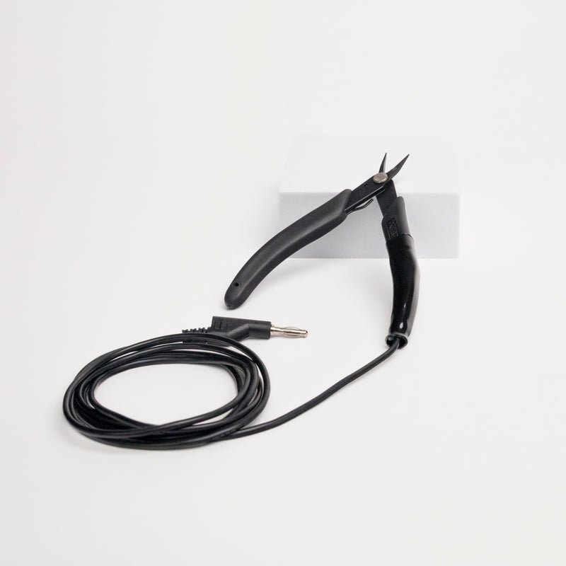 Grounded micro tipped pliers for permanent jewelry welding on a white background.