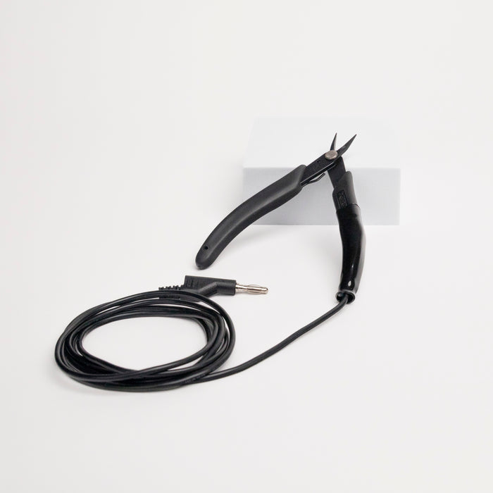 Grounded micro tipped pliers for permanent jewelry welding on a white background.