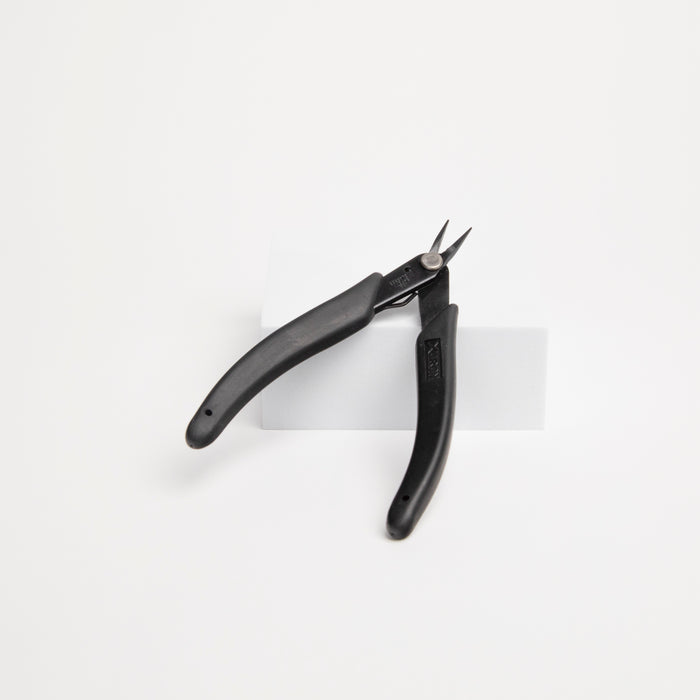 Pair of fine tipped pliers for micro welding on a white background
